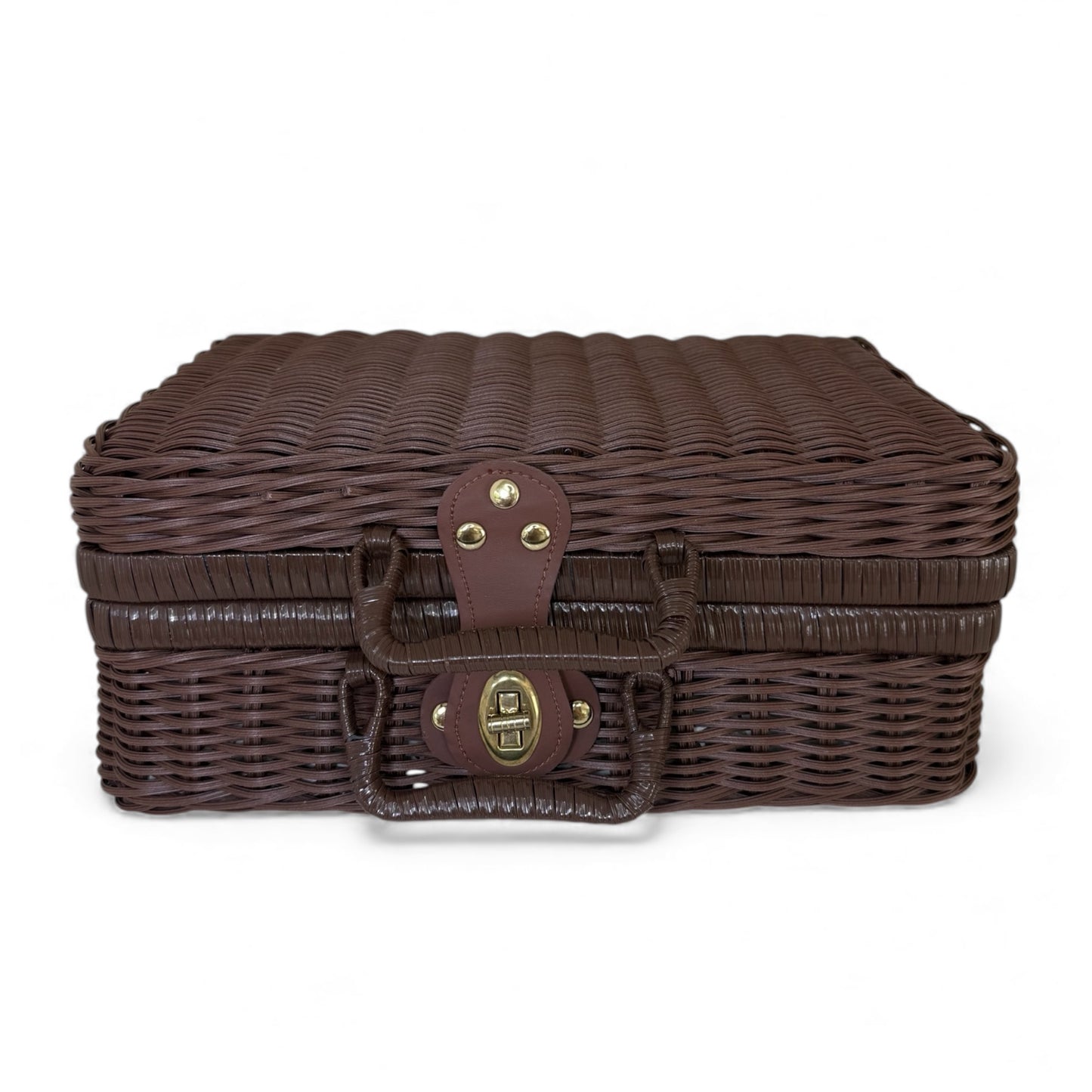 Closed dark wicker suitcase used as a baby gift hamper container