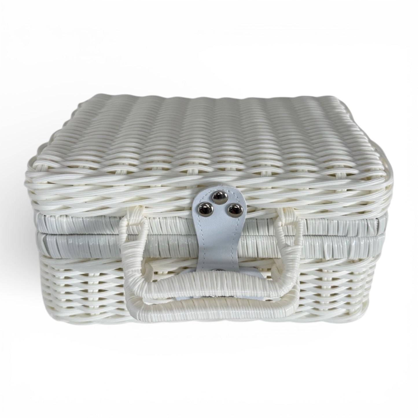 White woven suitcase hamper with secure clasp and handle, designed for elegant presentation of baby gift sets.