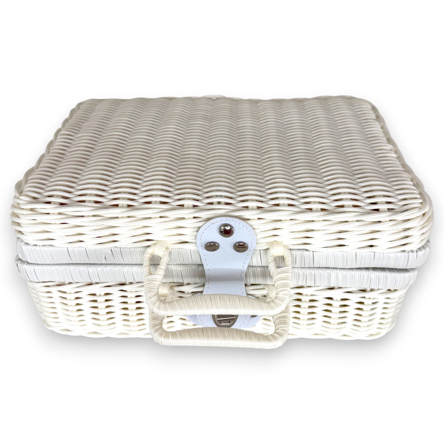 White keepsake suitcase baby hamper, closed and ready to gilt, designed as a premium newborn gift.