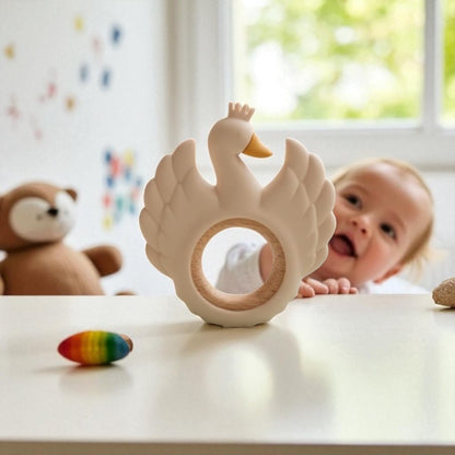 Neutral baby swan teether designed for gentle gum relief