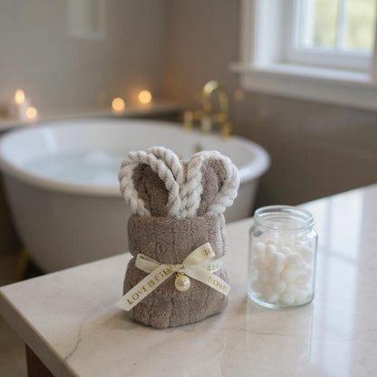 Soft mocha mini washcloth styled as bunny ears with ribbon, soft textured cloth ideal for newborn hampers