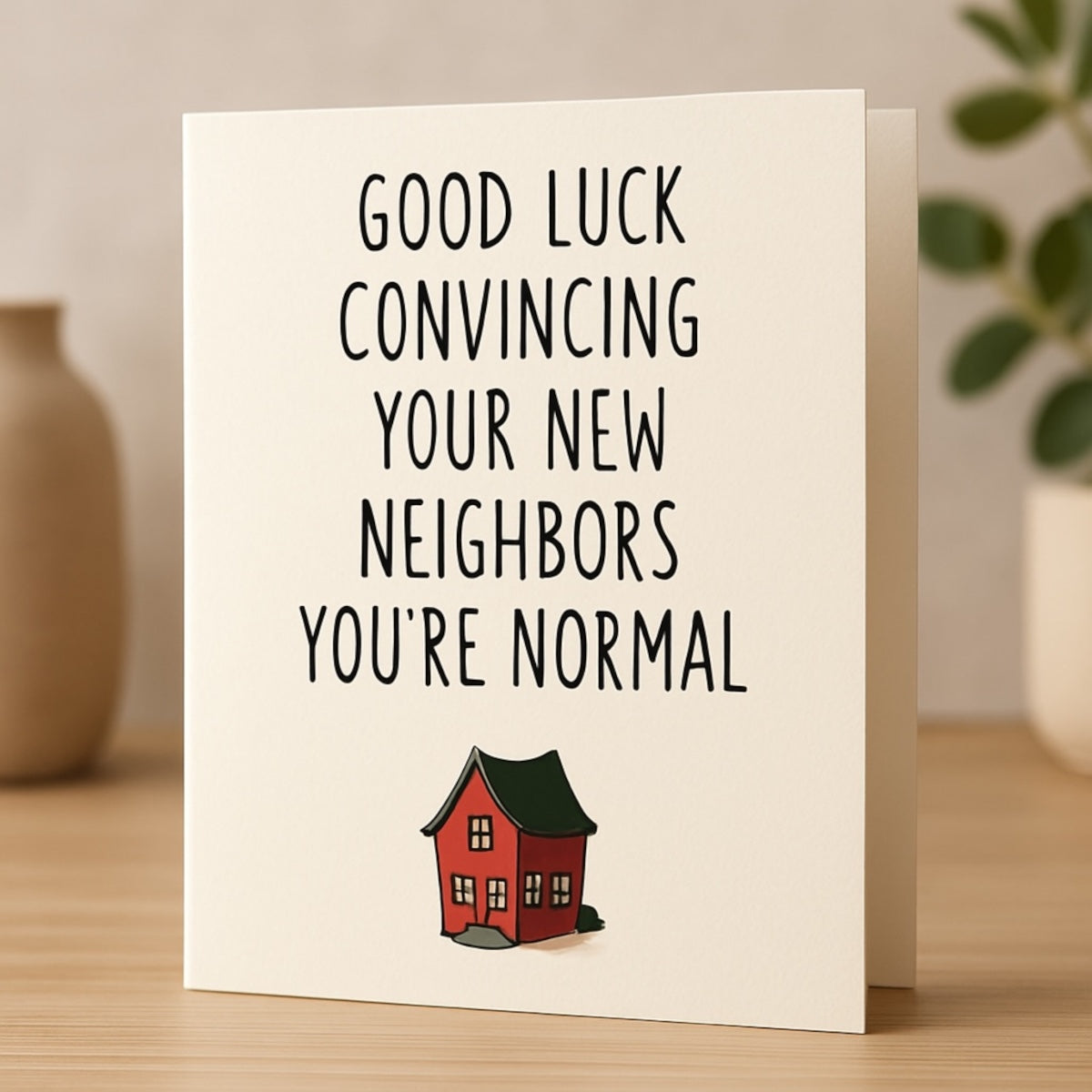 Humorous housewarming card with red house illustration 