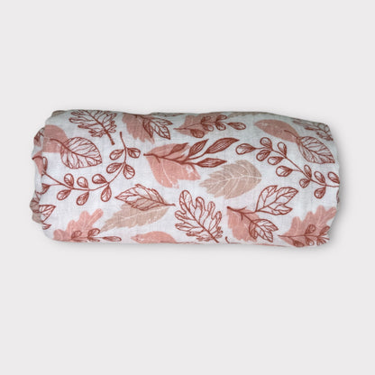 Pink muslin swaddle blanket for newborns, lightweight and breathable, ideal for everyday baby use.