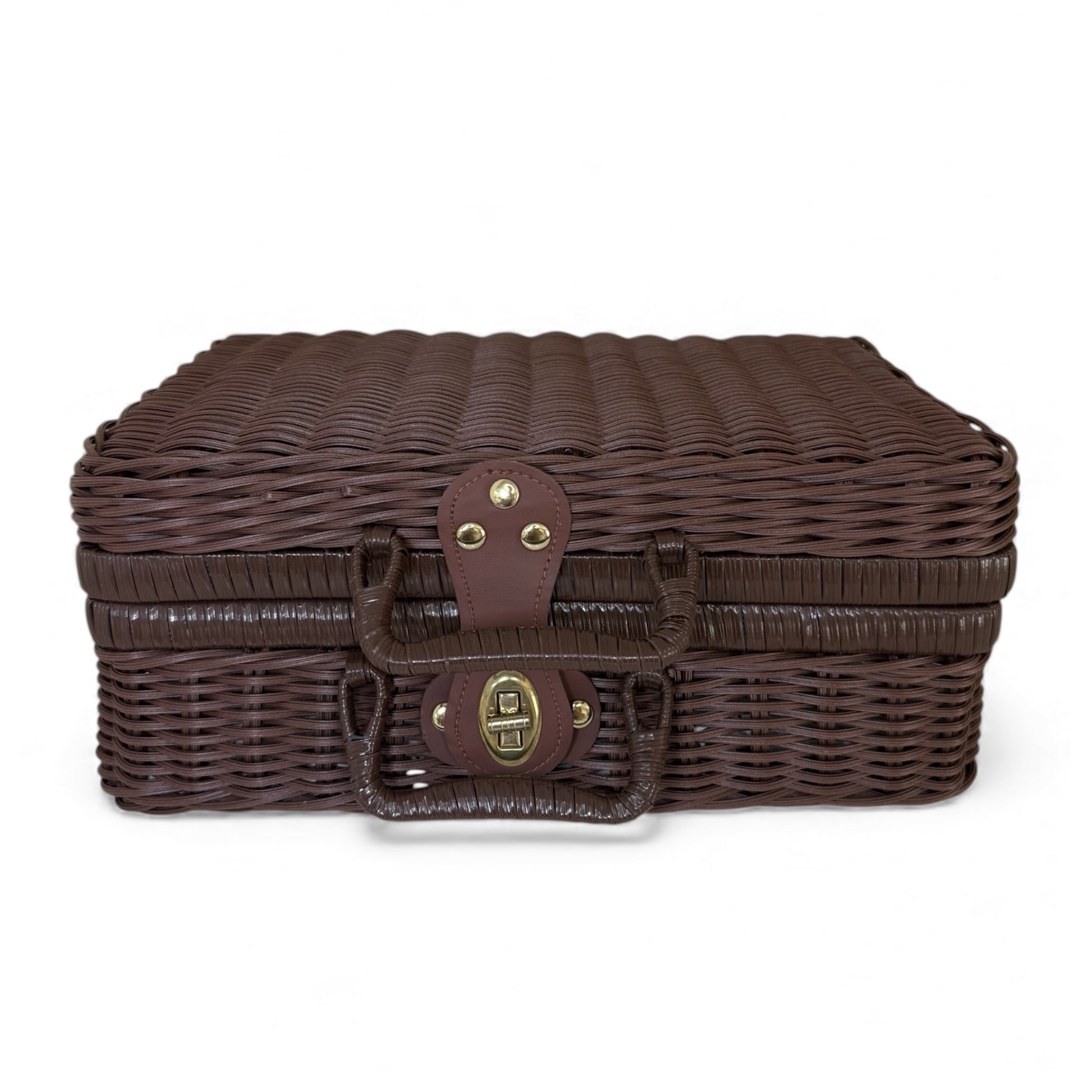 Closed dark wicker suitcase used as a baby gift hamper container