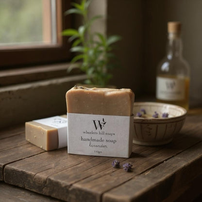Handmade lavender artisan soap bar on a wooden surface with dried botanicals