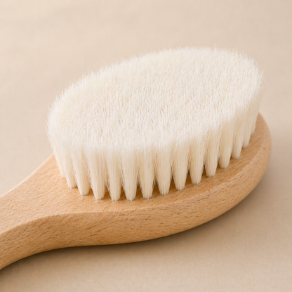 Close- up soft natural wool bristles on baby hair brush for delicate scalp care.
