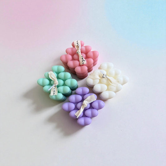 White heart-shaped decorative soy candle on a neutral surface | Wrap With Love