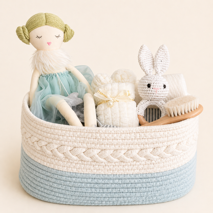 Luxury baby gift hamper in acqua tones with woven basquet, soft doll, bunny mini towel and baby essentials.
