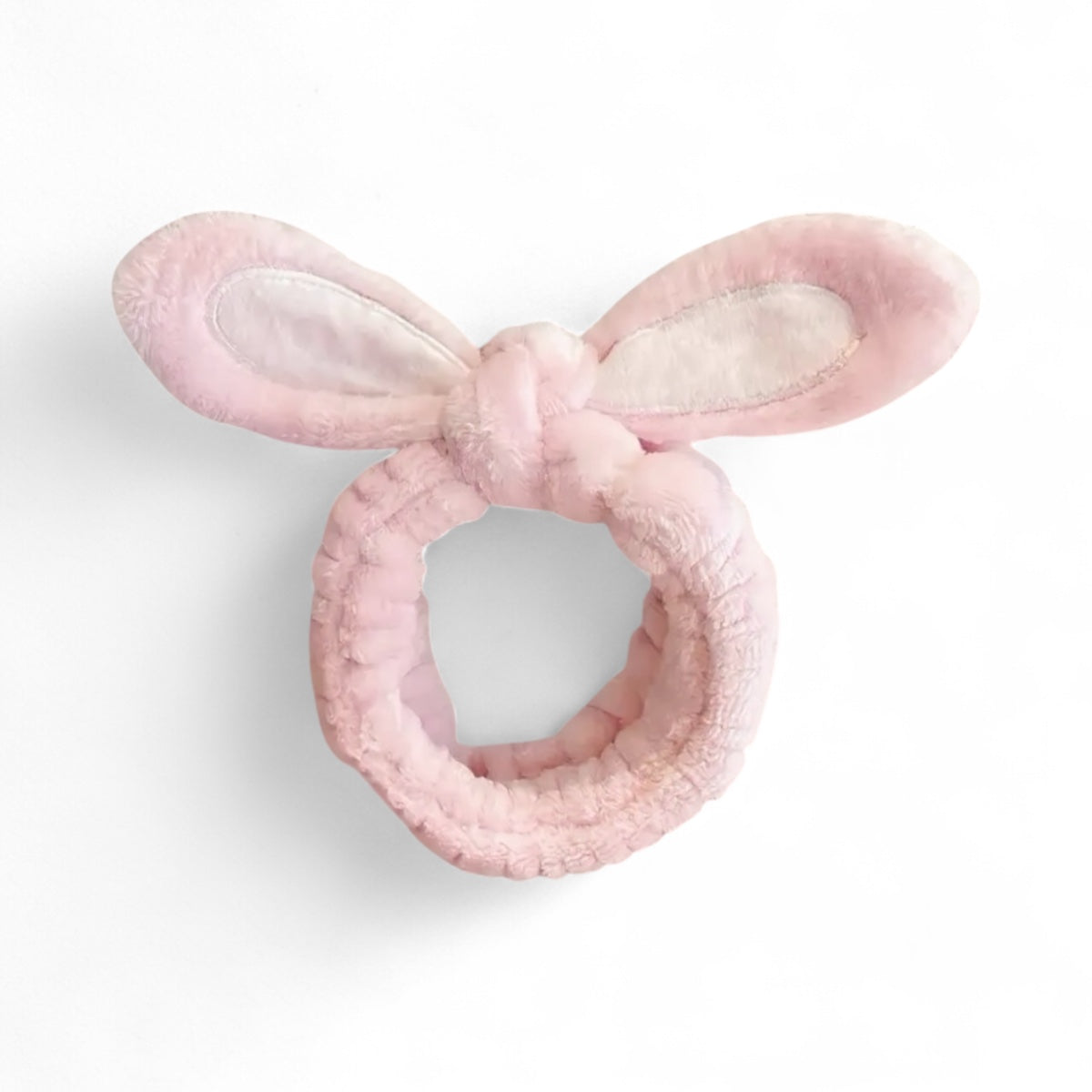 Soft plush skincare headband with bunny ears in light pink colour.