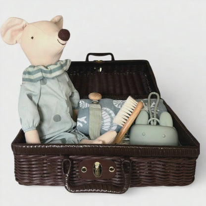 Mouse heirloom baby gift hamper arranged in a dark wicker suitcase with plush toy, muslin cloth, baby face cloth, wooden brush and baby essentials