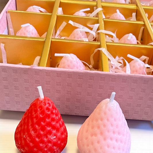 Gift box of 16 pink and red strawberry-shaped candles with satin ribbon | Wrap With Love