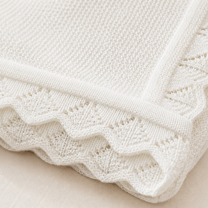 Close-up in white  knitted blanket 